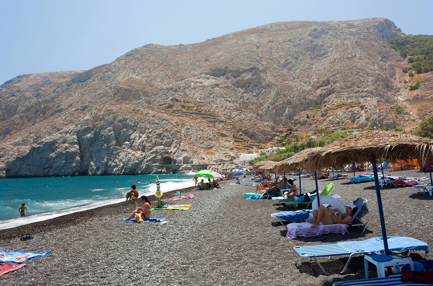 Santorini Island, Greece - July 19, 2012: Beautiful Santorini Beach. The beaches of the island are all unique and different because of the volcanic origin.